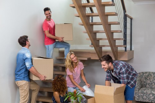 Professional movers handling boxes in Edgware