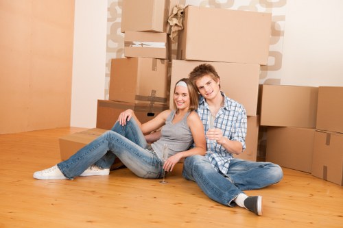 Professional removalists loading a van with household items