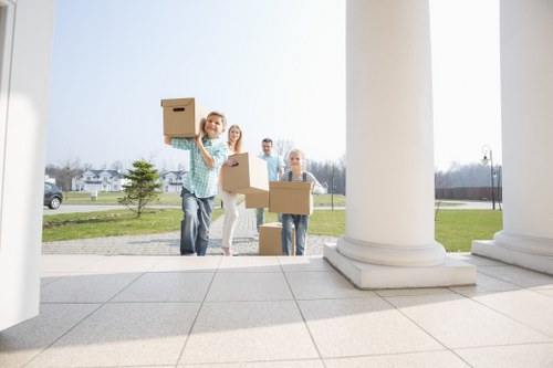 Professional removals man preparing furniture for pick-up