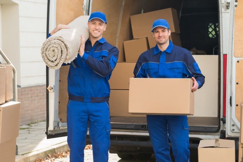 Professional movers handling household items in Becontree Heath