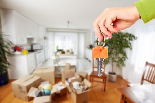 Movers transporting large items carefully