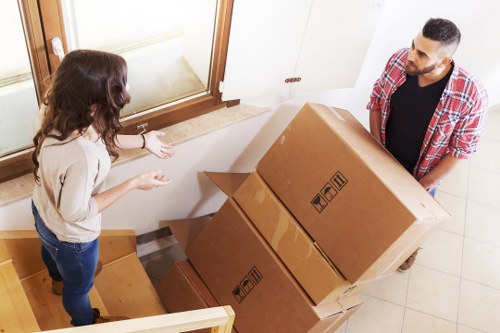 Removals team efficiently loading a van