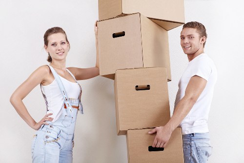 Packed office items being loaded into a removal van.